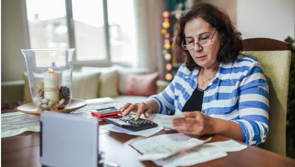 older woman looking at finances